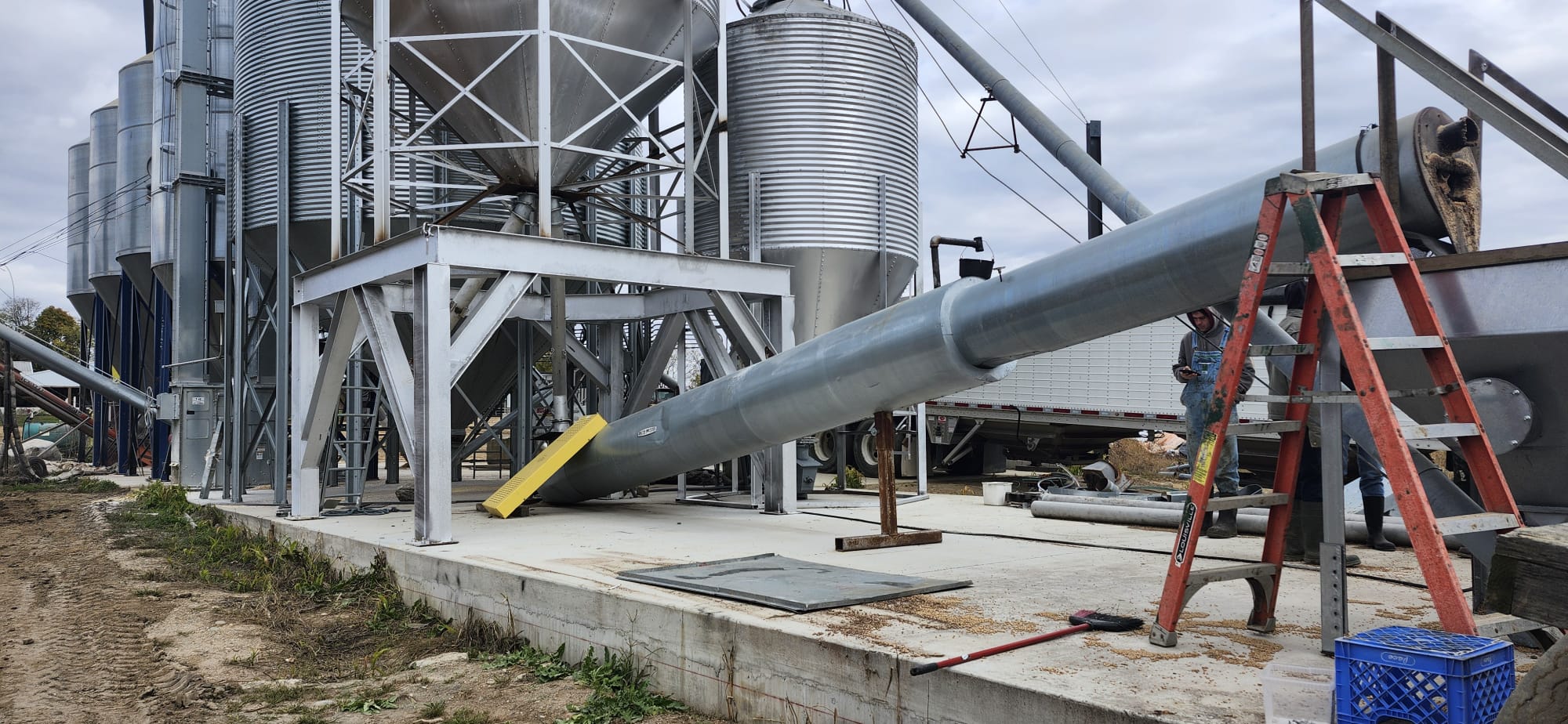 Continuous-flow soybean roaster used on a farm to heat-treat soybeans.